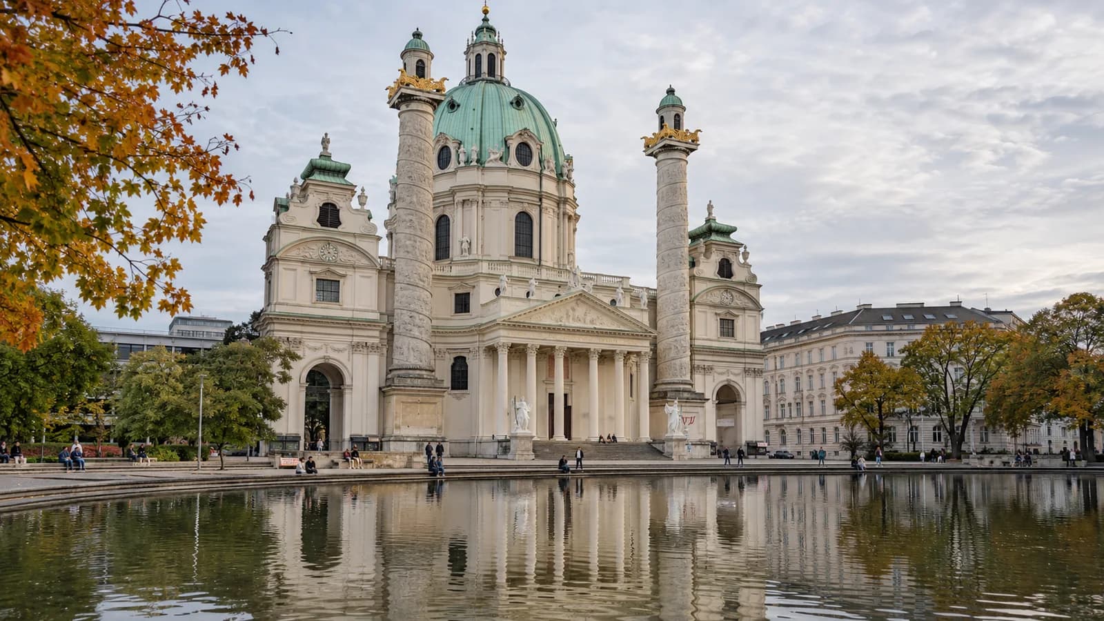 AI-created editorial view of Karlskirche and its reflecting pond at Karlsplatz in Vienna, under soft autumn daylight.